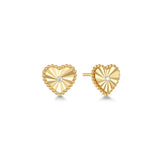 Gold heart-shaped earrings with a cubic zirconia center on a white background

