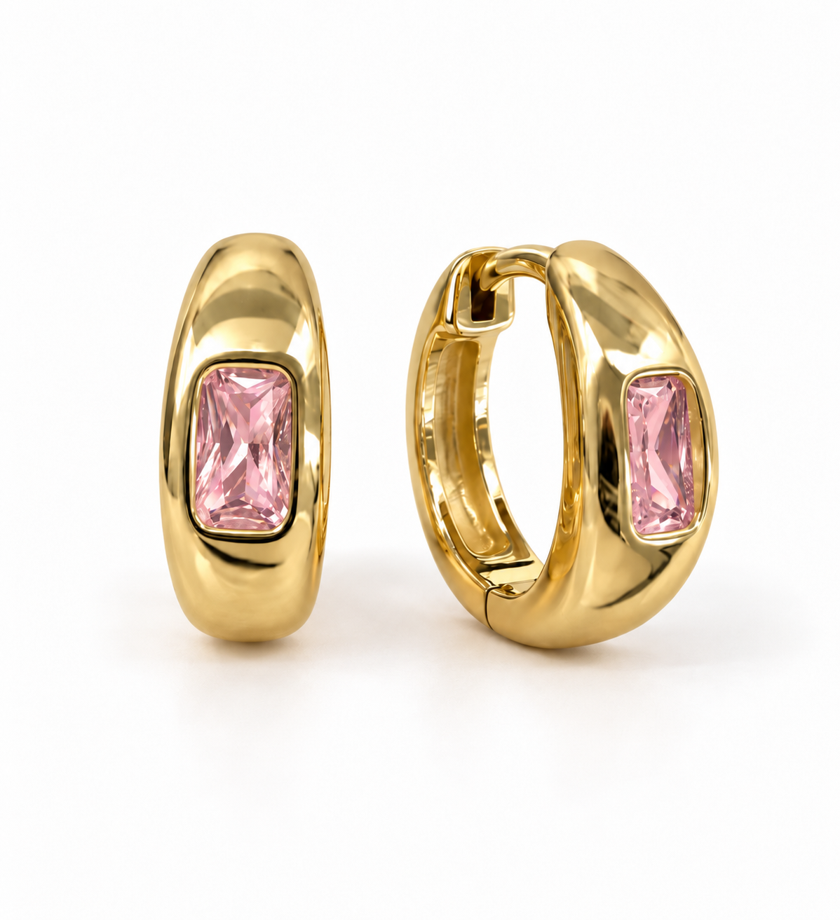 A pair of gold huggie hoop earrings with rectangular pink gemstones, shown from front and side angleS.