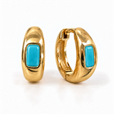 A pair of gold huggie hoop earrings with rectangular pink gemstones, shown from front and side angles 
