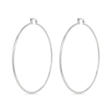 Pair of silver hoop earrings on a white background