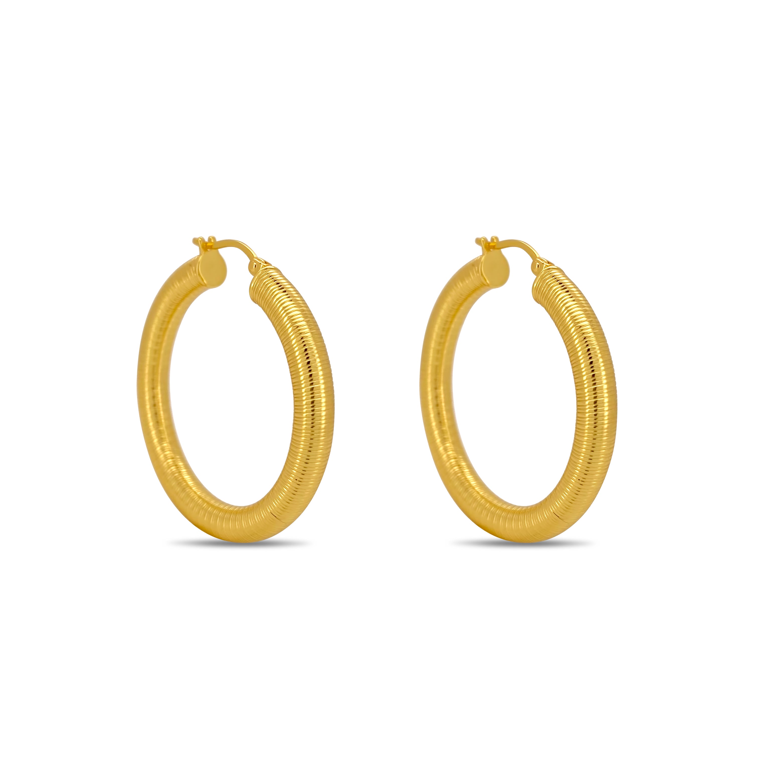 Gold hoop earrings on a white background