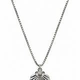 A silver-toned chain necklace with a textured, scallop-shaped shell pendant.