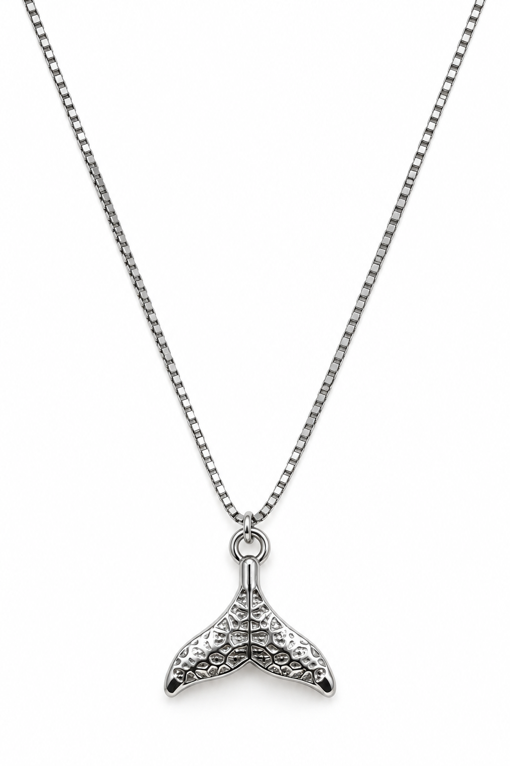 A silver chain necklace with a textured mermaid tail fin pendant.