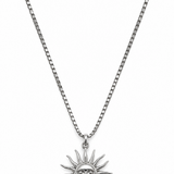 A silver-toned sun pendant necklace with a detailed sun face and radiating rays.