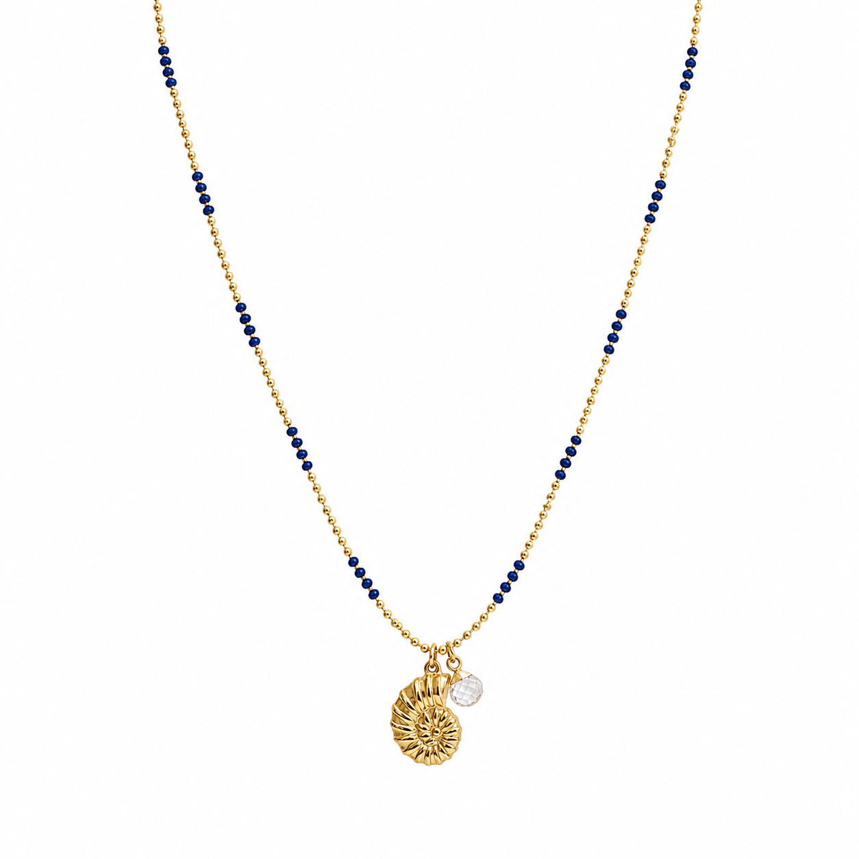 gold and dark blue enamel necklace chain with a shell charm and a clear quartz charm