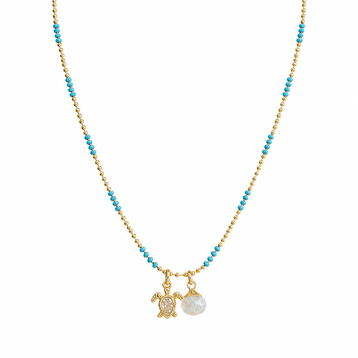 gold and blue enamel necklace chain with a gold turtle charm with a pear shaped cz in the middle and a moonstone charm