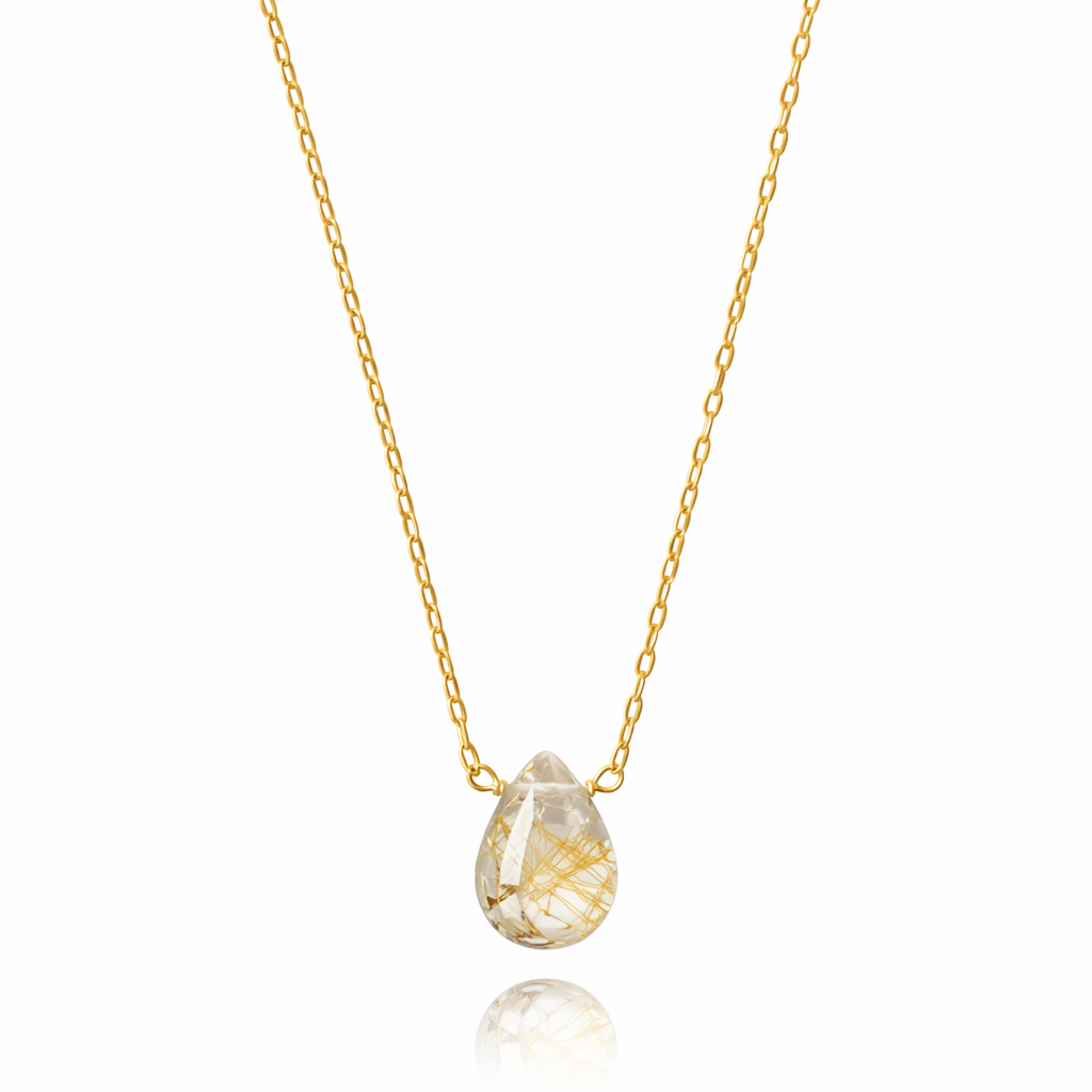 Gold necklace with a teardrop-shaped pendant on a white background