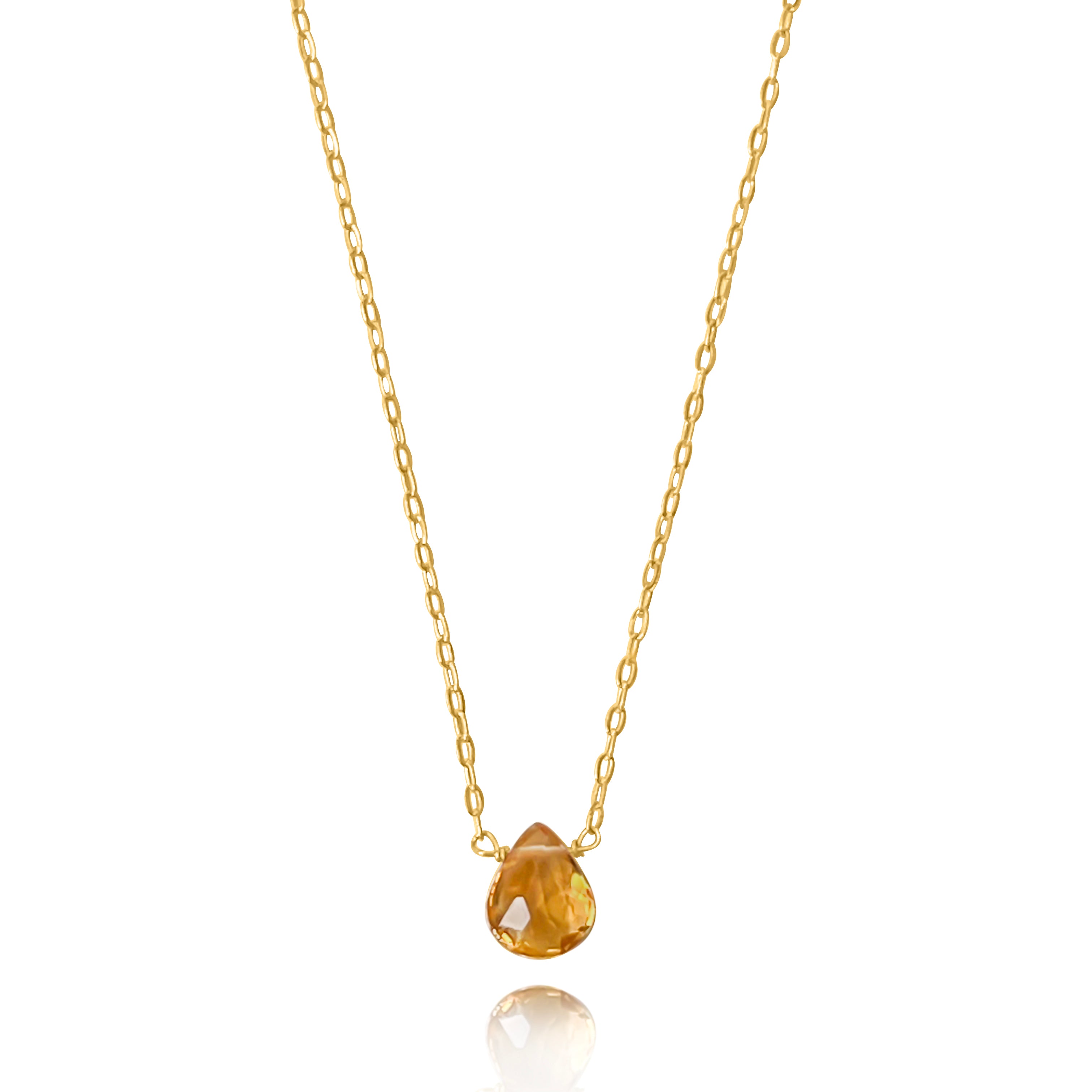 Gold necklace with a teardrop-shaped pendant on a white background